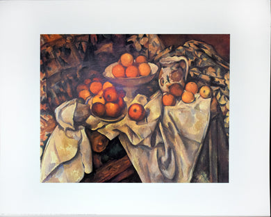 Apples and Oranges by Paul Cezanne 20 by 16 poster print with a white border. Unframed. This poster is a classic painting  of a still life with 2 bowls of apples and oranges resting on a white sheet in an impressionist style. There is a patterned sheet behind the furthest bowl. There is also a pitcher resting to the right of the two bowls with a curvy top and big handle it also has what appears to be sunflowers painted on it. 