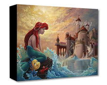 Load image into Gallery viewer, Ariel the Mermaid sits atop a rock in this canvas image of a disney classic. She looks off into the distance at a castle the waves are splashing all around her. Flounder jumps up out of the water to look at Ariel. Seagulls fly in the sky above in the background. 
